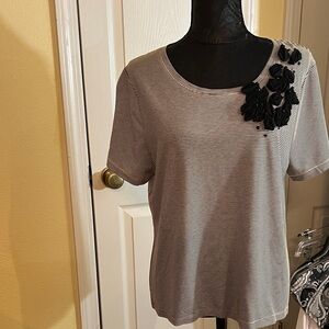 Elegant Black and White Striped Women's Top with Floral Accent